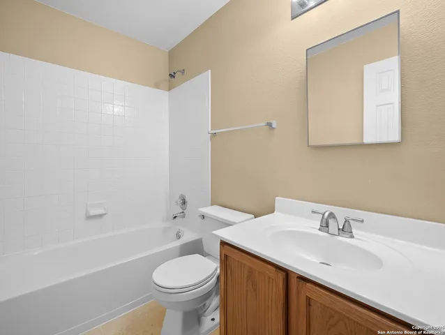 a bathroom with a sink a toilet and a bathtub