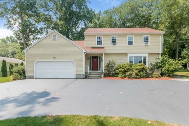 17 Sterling Road Trumbull, CT 06611 - Photo 1 of 1 a front view of a house with a yard and garage