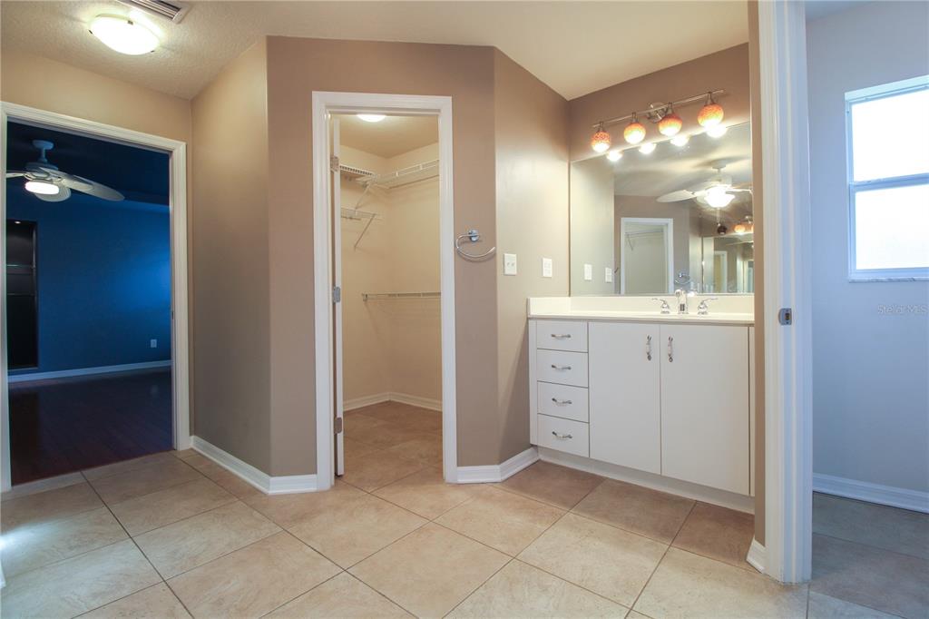 6065 Spruce Point Circle Port Orange, FL 32128 - Photo 16 of 33 wooden floor with a bathroom and a sink