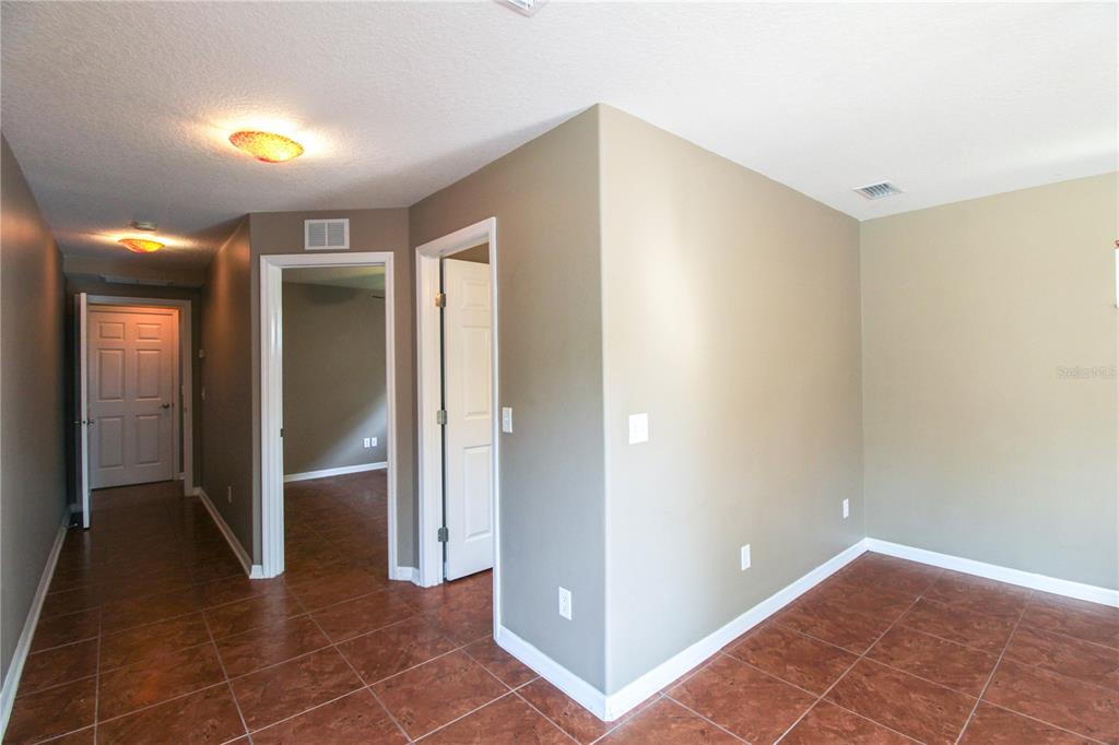6065 Spruce Point Circle Port Orange, FL 32128 - Photo 25 of 33 a view of livingroom with hallway