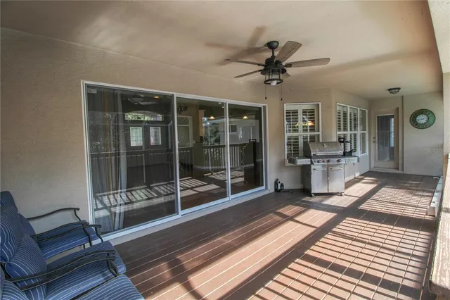 a view of a room with wooden floor and garden