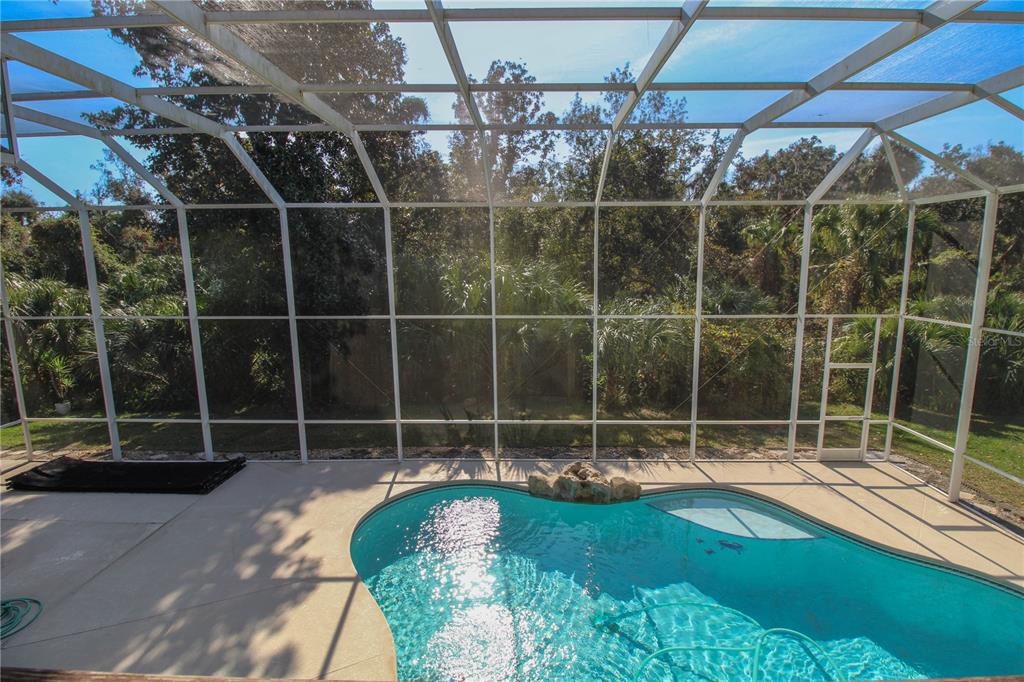 6065 Spruce Point Circle Port Orange, FL 32128 - Photo 29 of 33 a view of a room with wooden floor and garden