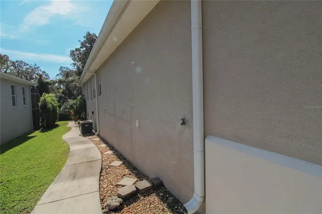 a living room with a fireplace and a flat screen tv