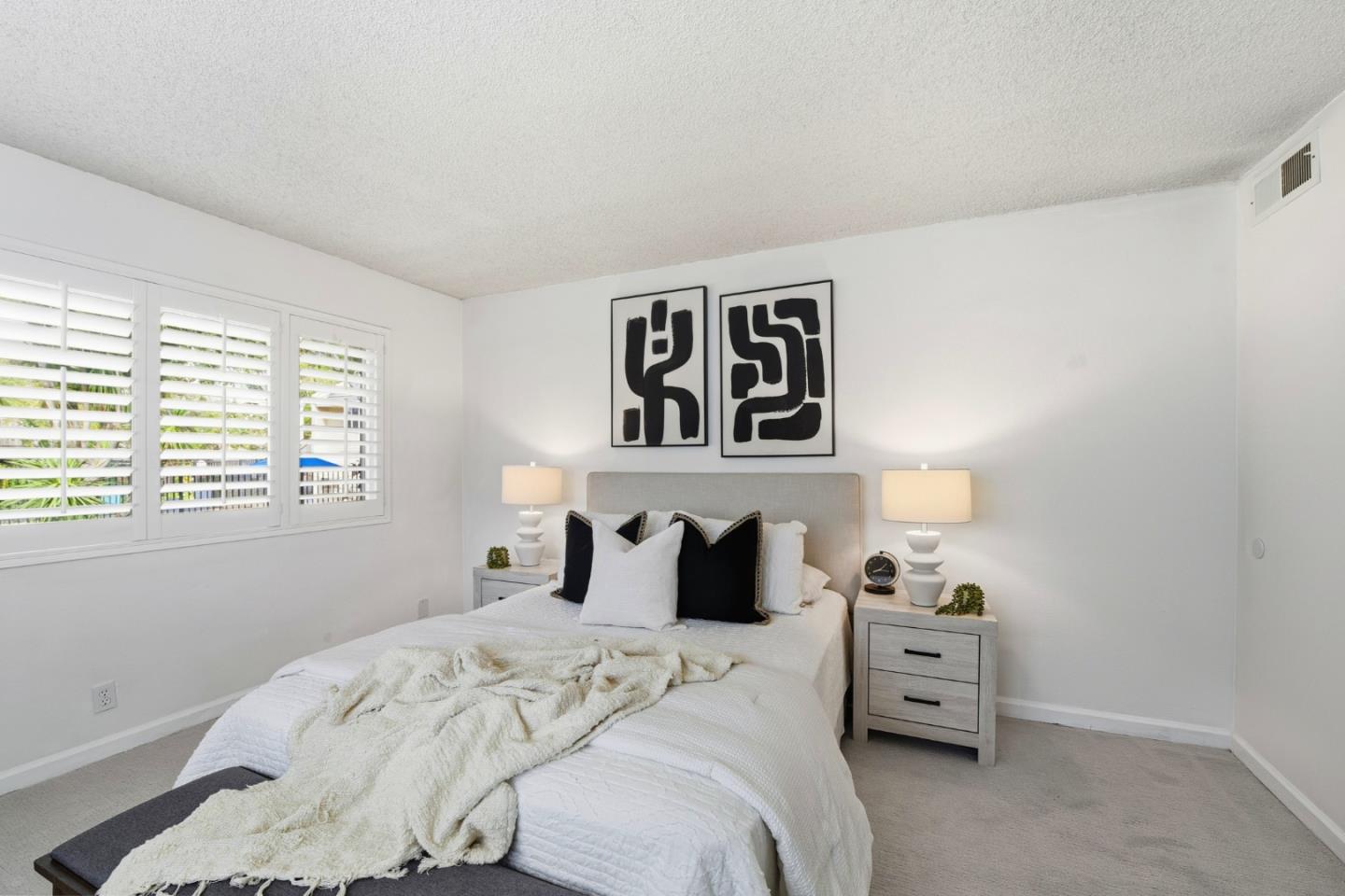 1485 De Rose Way, Unit 123 San Jose, CA 95126 - Photo 12 of 21 a bedroom with a bed and night stand