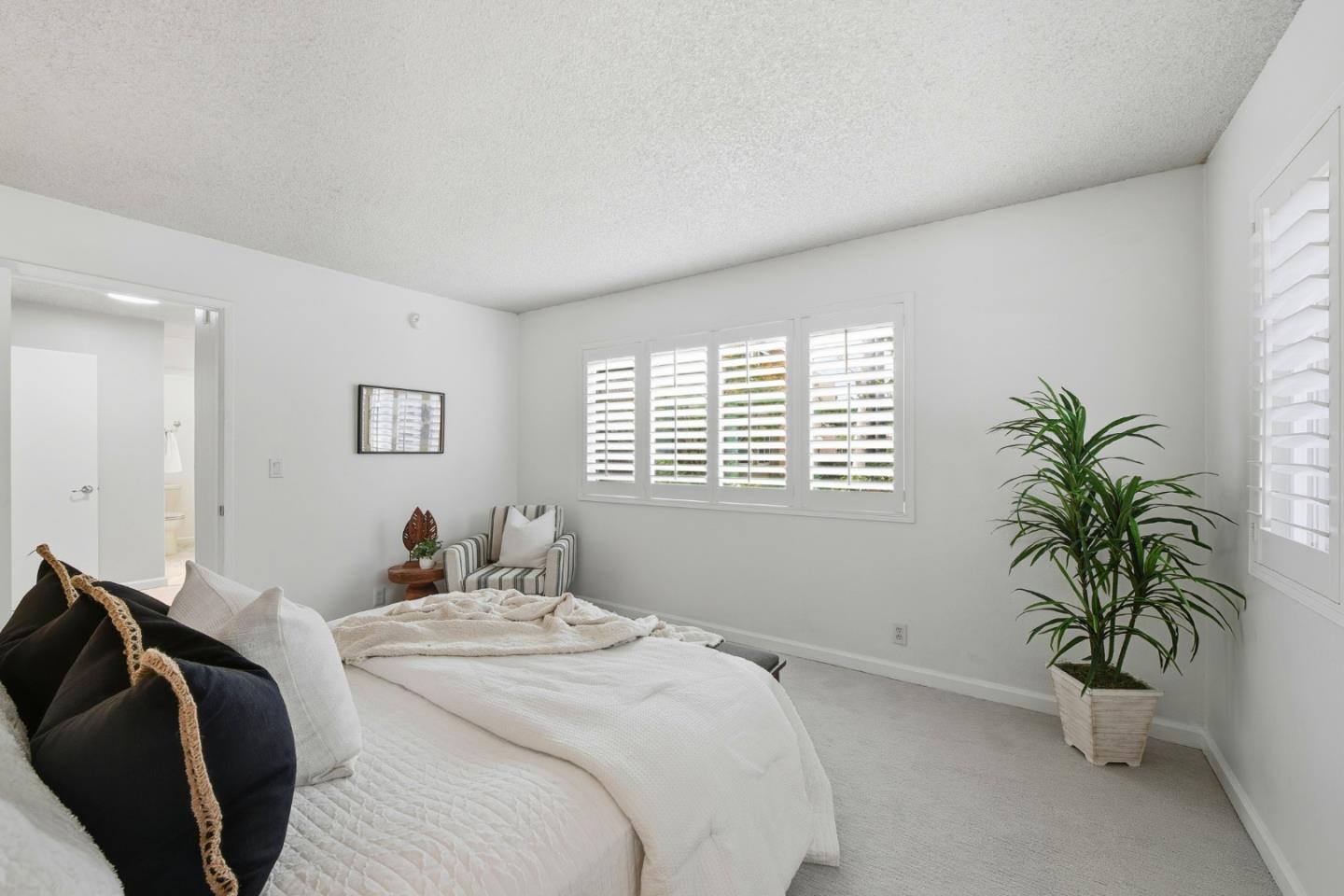 1485 De Rose Way, Unit 123 San Jose, CA 95126 - Photo 13 of 21 a bedroom with a bed and a window