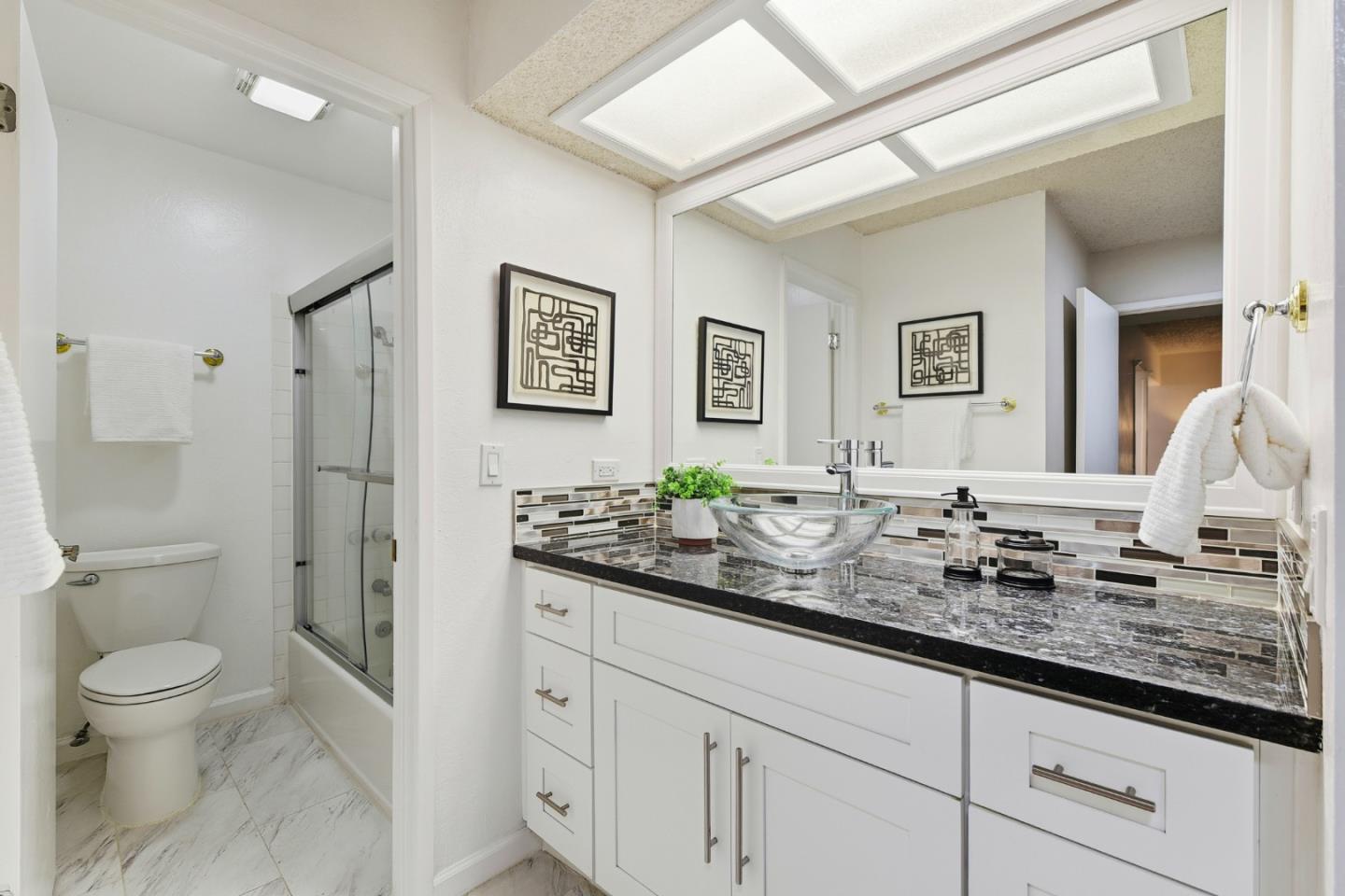 1485 De Rose Way, Unit 123 San Jose, CA 95126 - Photo 14 of 21 a bathroom with double sink and a mirror