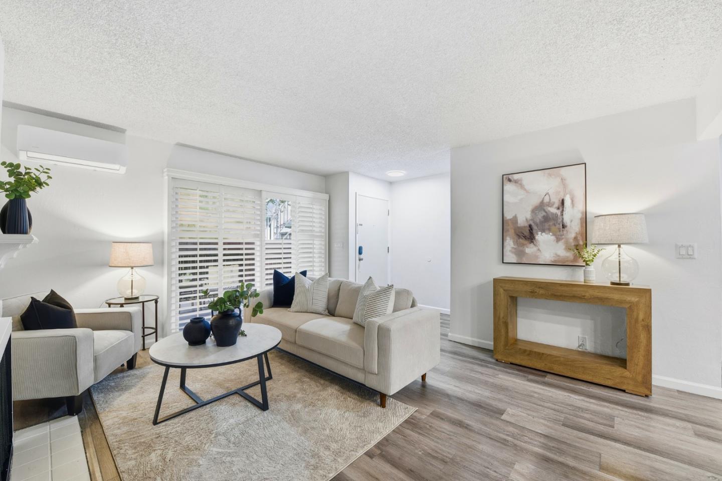 1485 De Rose Way, Unit 123 San Jose, CA 95126 - Photo 3 of 21 a living room with furniture and a fireplace