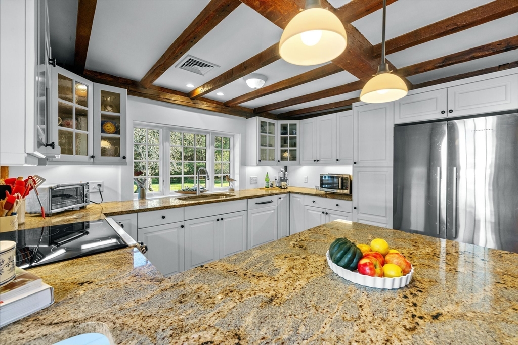 6 Rachael's Lane Duxbury, MA 02332 - Photo 11 of 42 a kitchen with stainless steel appliances granite countertop a sink stove and refrigerator