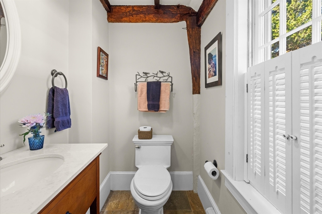 6 Rachael's Lane Duxbury, MA 02332 - Photo 17 of 42 a white toilet sitting next to a bathroom sink