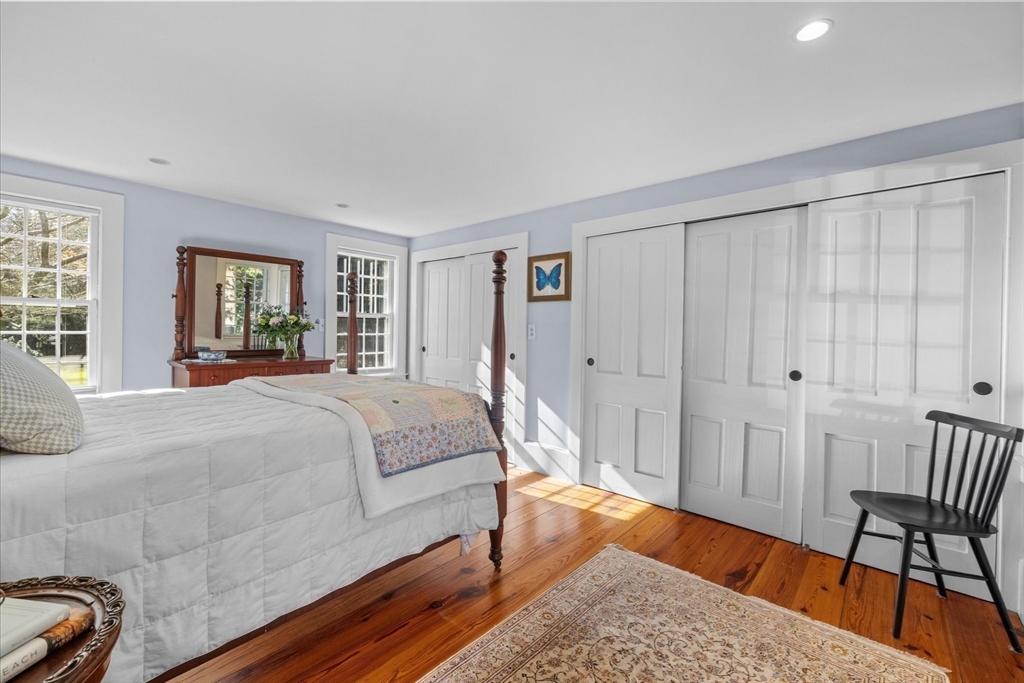 6 Rachael's Lane Duxbury, MA 02332 - Photo 19 of 42 a bedroom with a bed and a chair