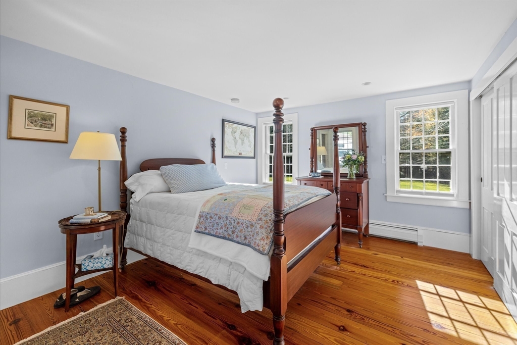 6 Rachael's Lane Duxbury, MA 02332 - Photo 20 of 42 a bedroom with a bed a table and chair