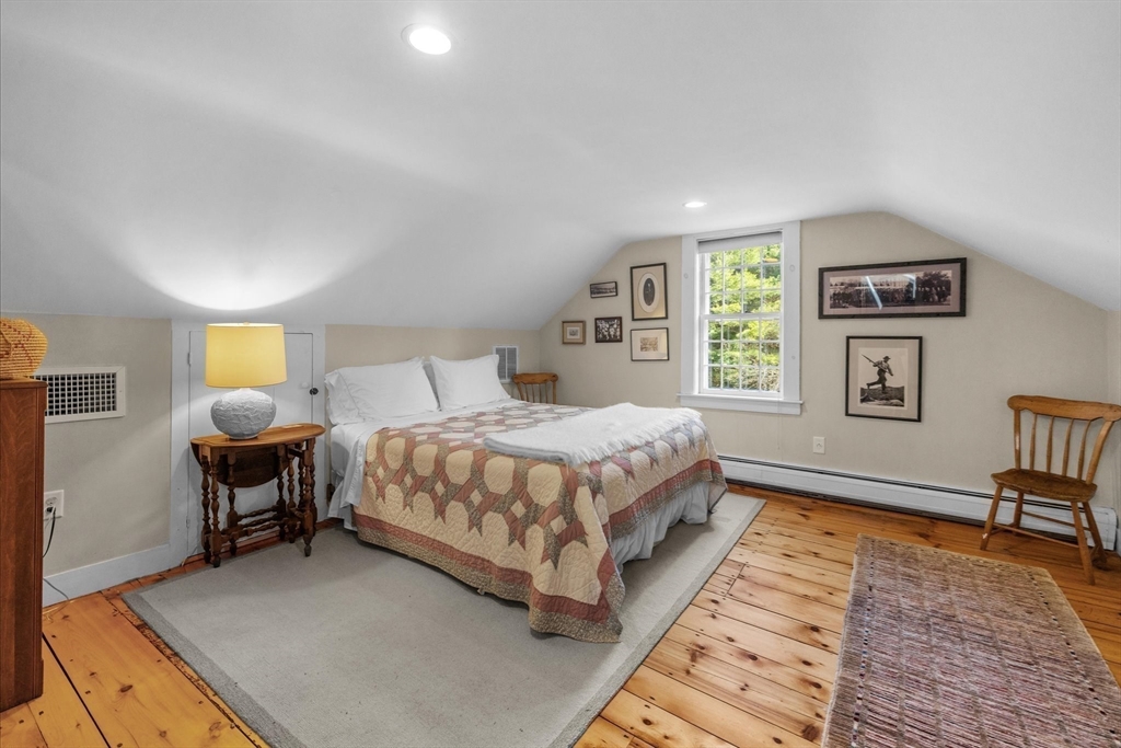 6 Rachael's Lane Duxbury, MA 02332 - Photo 25 of 42 a bed room with a bed and a chair