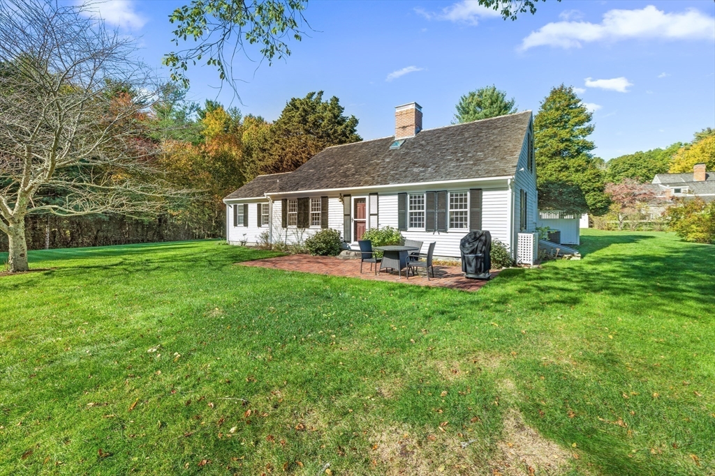 6 Rachael's Lane Duxbury, MA 02332 - Photo 31 of 42 a view of a house with a yard and potted plants