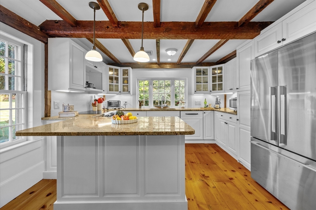 6 Rachael's Lane Duxbury, MA 02332 - Photo 10 of 42 a kitchen with stainless steel appliances granite countertop a sink window and refrigerator