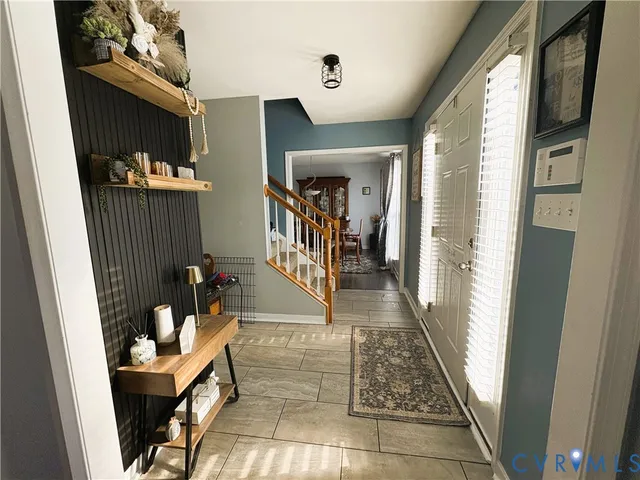 a hallway with furniture and rug