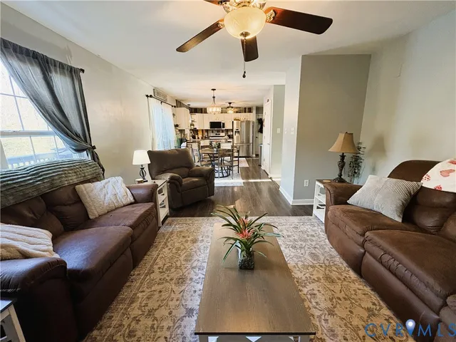 a living room with furniture and a rug