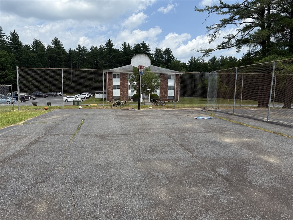 5 Turnpike Road, Unit 213 Townsend, MA 01469 - Photo 2 of 8 a view of a basketball court