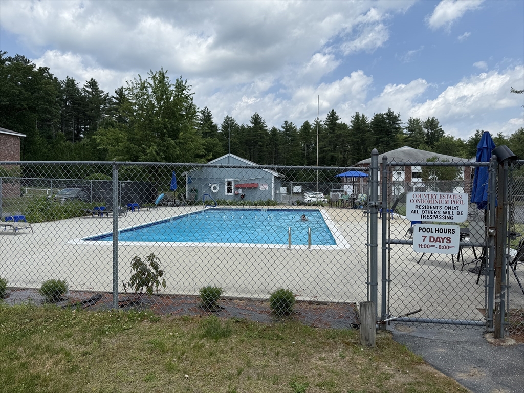 5 Turnpike Road, Unit 213 Townsend, MA 01469 - Photo 3 of 8 a view of a tennis court