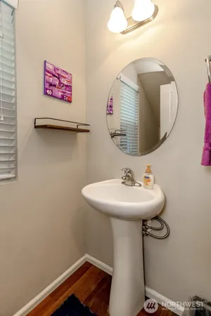 a bathroom with a sink and mirror