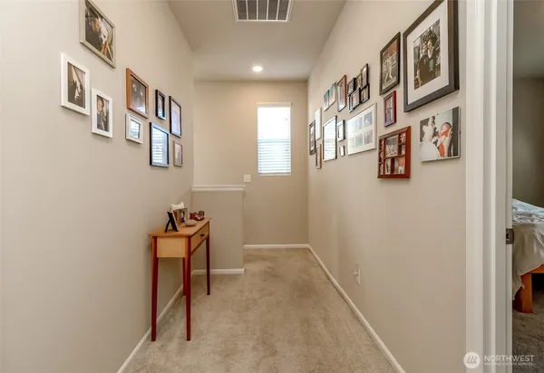 a view of a hallway with seating area