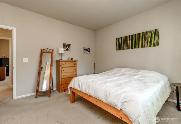 a bedroom with a bed and a walk in closet