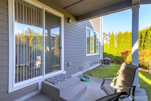 a view of a house with a yard patio and sitting area