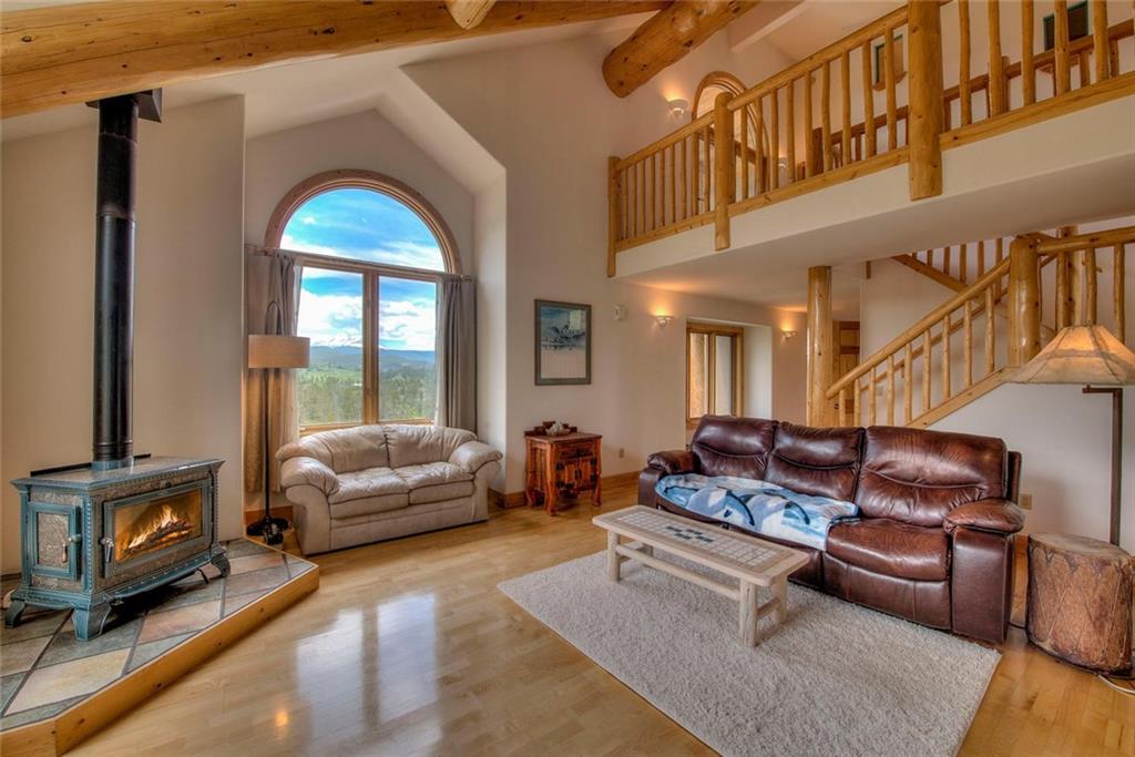 482 Idlewild Drive Dillon, CO 80435 - Photo 2 of 35 a living room with furniture and a fireplace