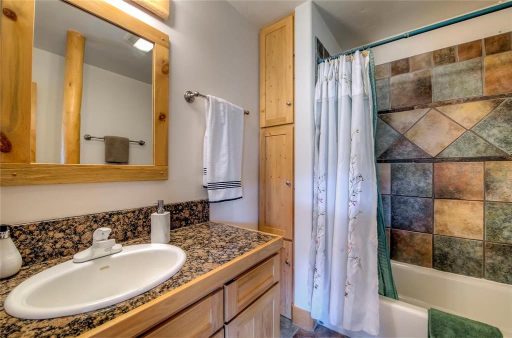 482 Idlewild Drive Dillon, CO 80435 - Photo 15 of 35 a bathroom with a sink and a mirror