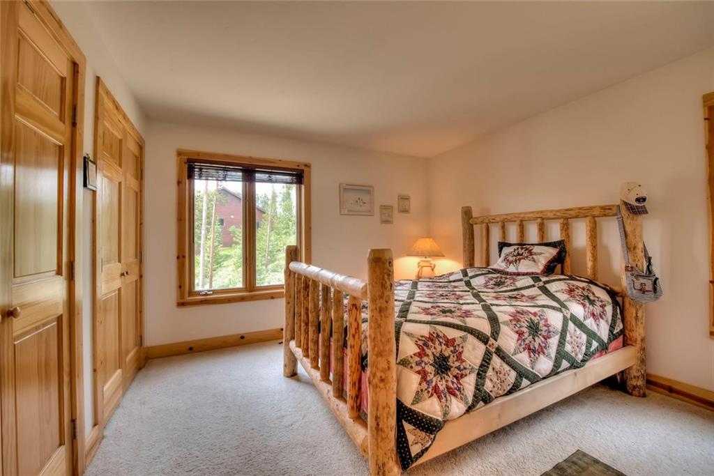 482 Idlewild Drive Dillon, CO 80435 - Photo 16 of 35 a bedroom with a bed and window