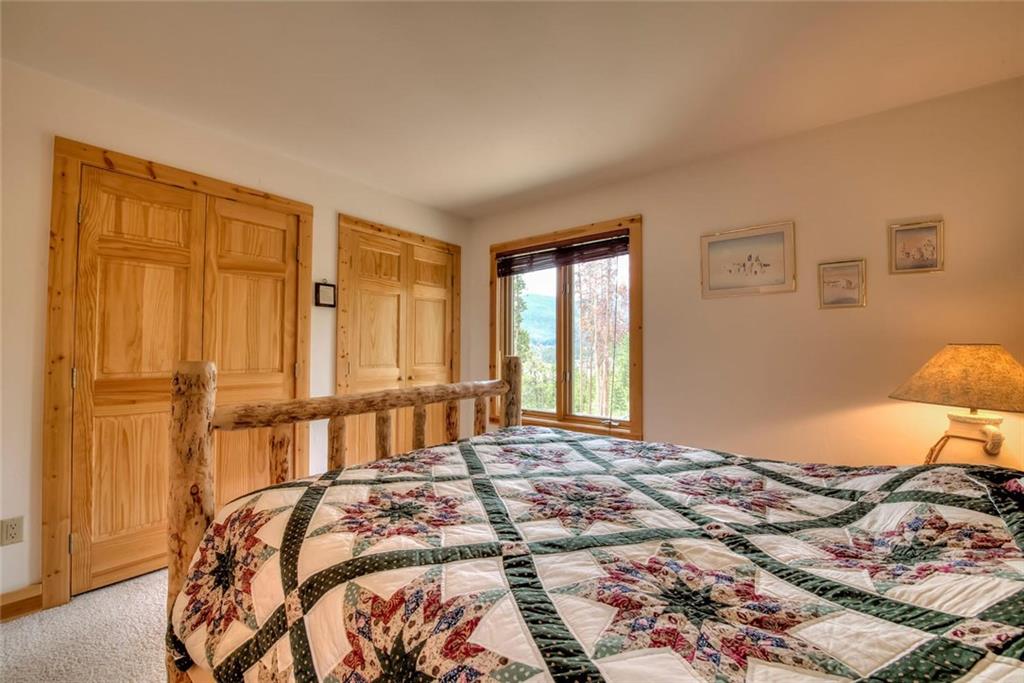 482 Idlewild Drive Dillon, CO 80435 - Photo 17 of 35 a bedroom with a bed and a window
