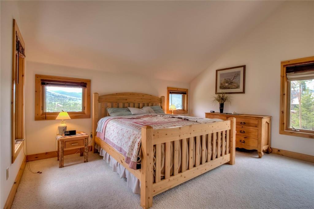 482 Idlewild Drive Dillon, CO 80435 - Photo 9 of 35 a bed sitting in a bedroom next to a window