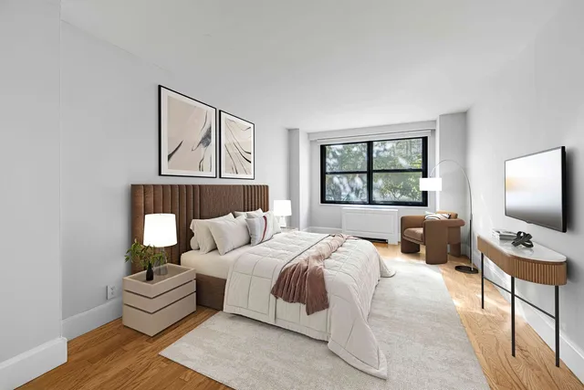 a bedroom with a bed and a couch