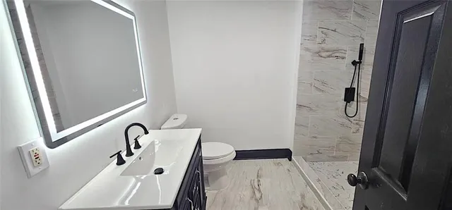 a bathroom with a bathtub and shower