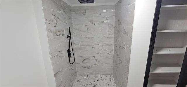 a bathroom with a glass shower door