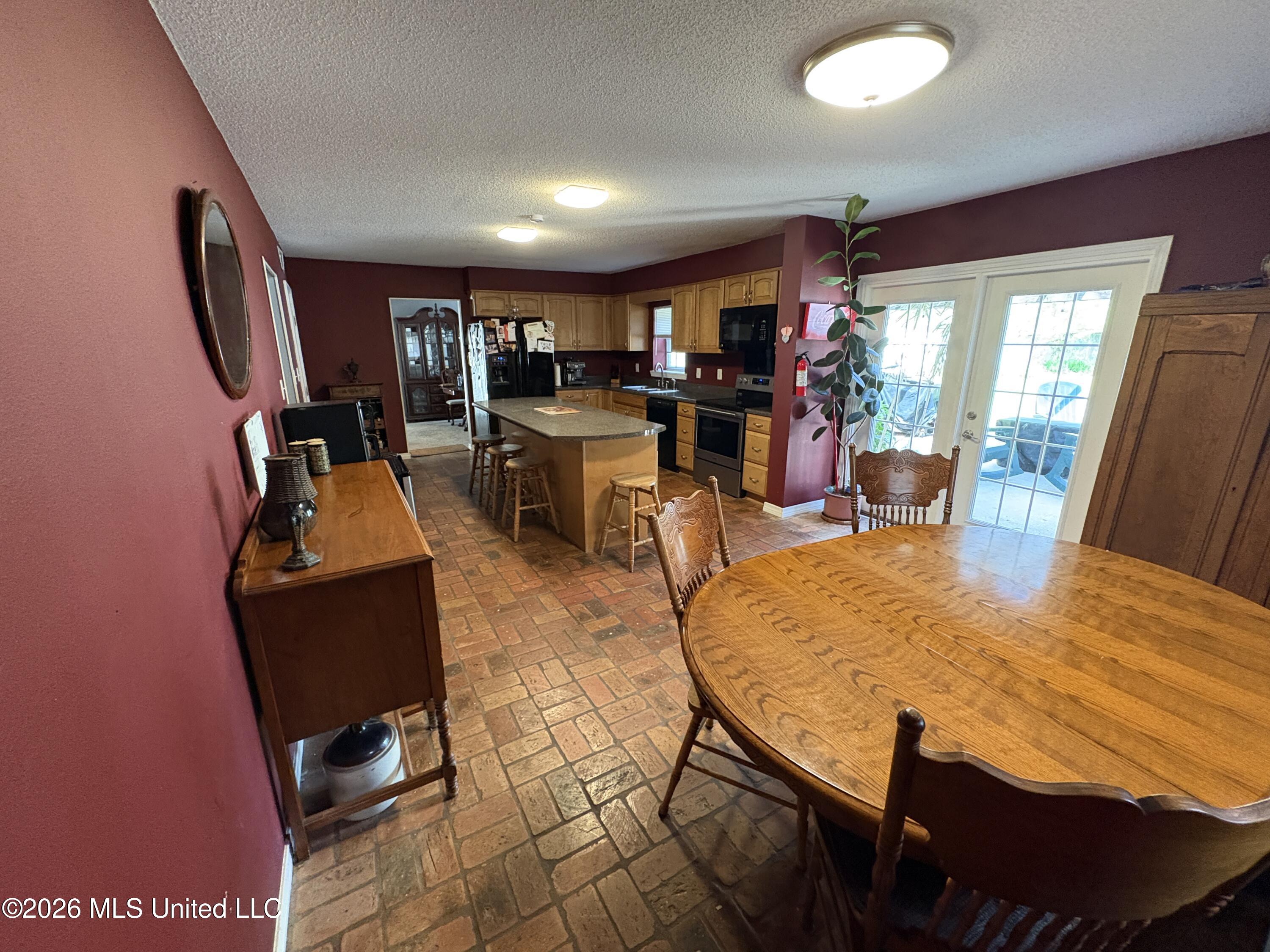13704 Coleman Street Moss Point, MS 39562 - Photo 12 of 50 Breakfast Area with Patio Doors