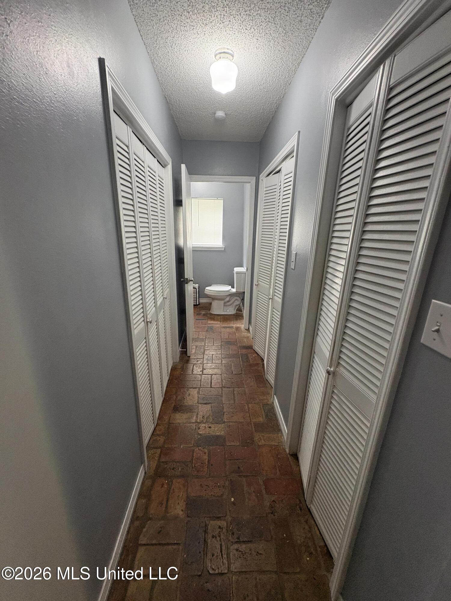 13704 Coleman Street Moss Point, MS 39562 - Photo 19 of 50 Downstars .5 bath hallway with storage a