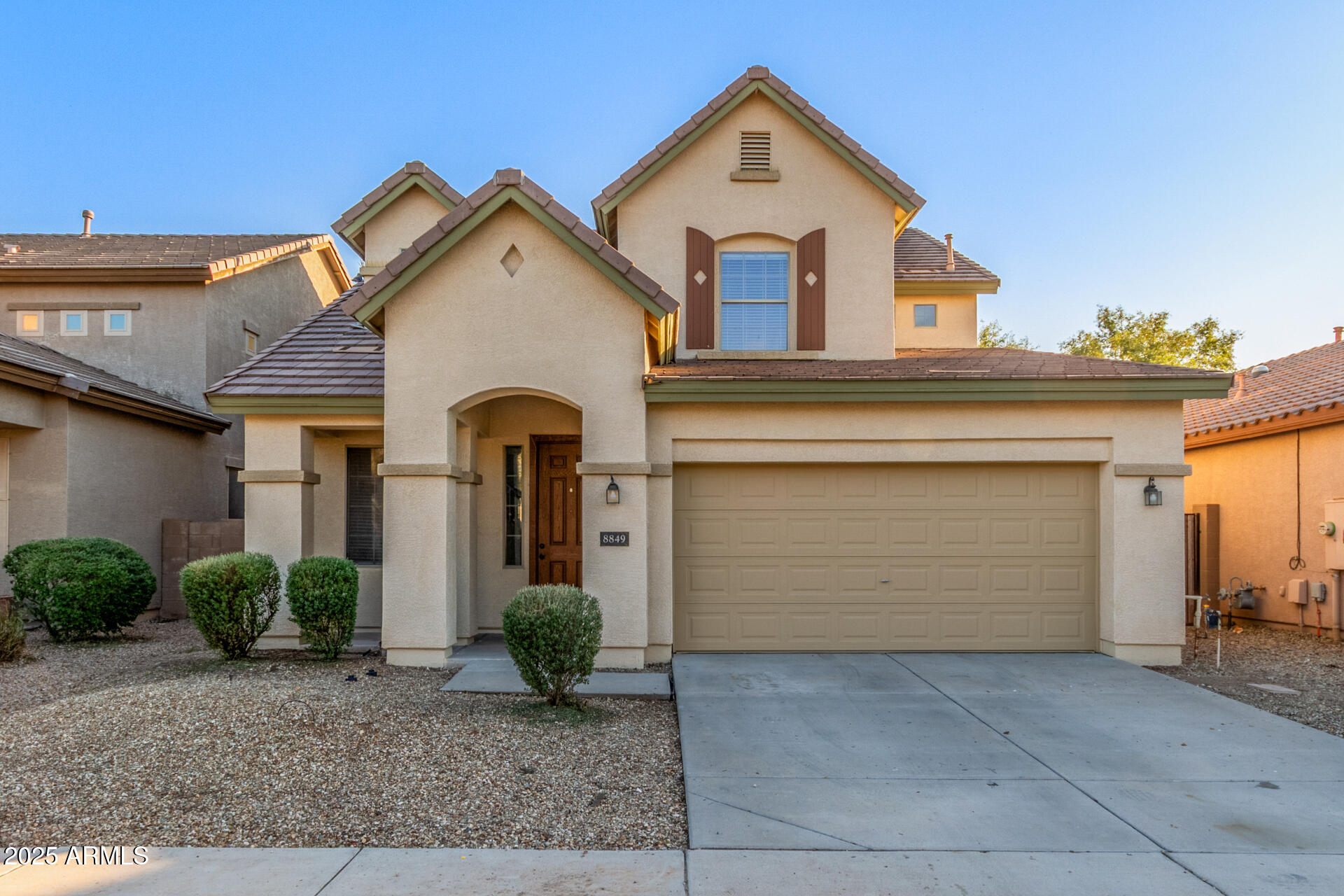 8849 West Cordes Road Tolleson, AZ 85353 - Photo 1 of 33 a view of a white house with large windows