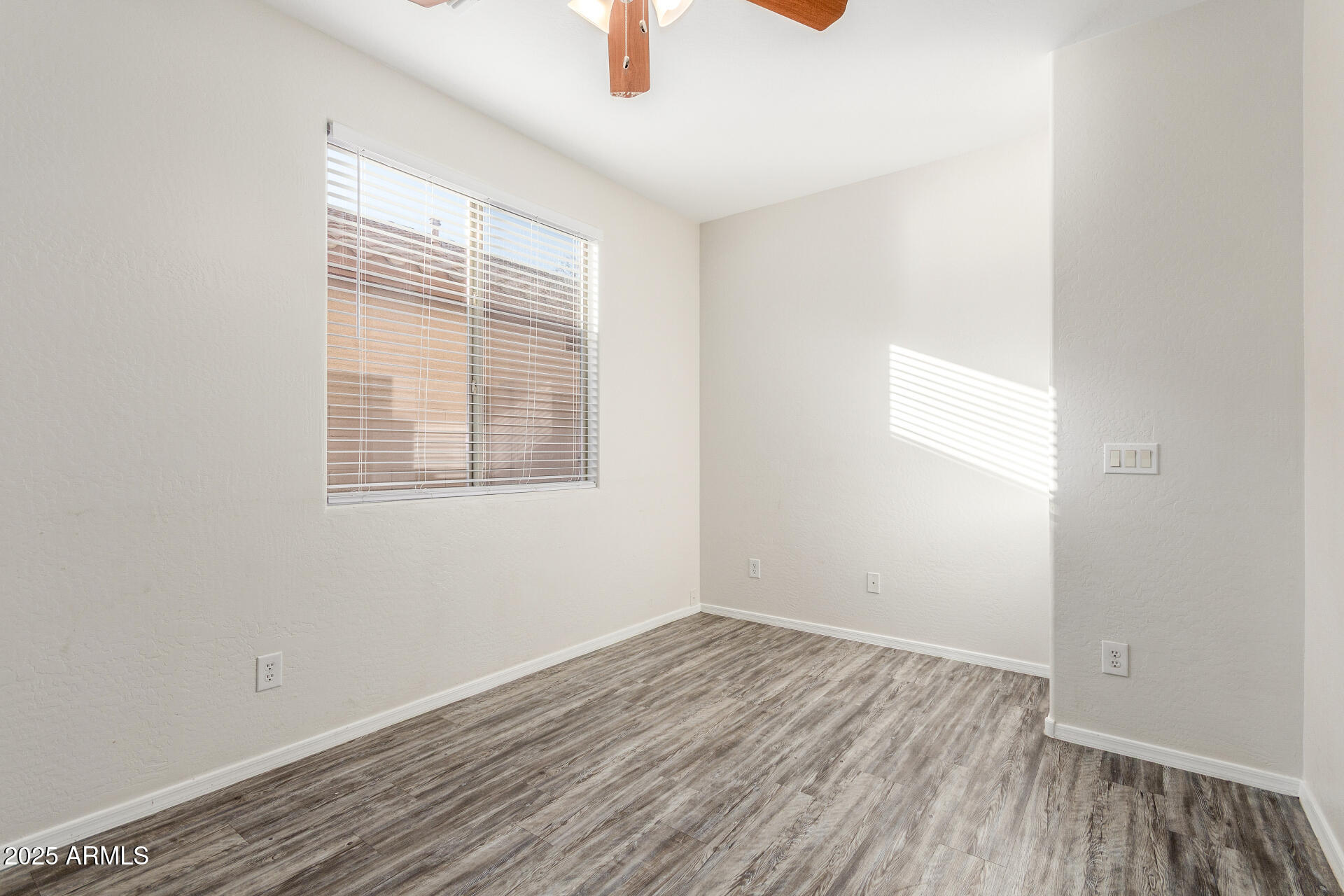 8849 West Cordes Road Tolleson, AZ 85353 - Photo 28 of 33 an empty room with a window