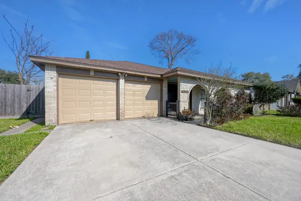 a view of garage and yard