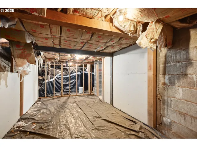 a view of a room with wooden walls
