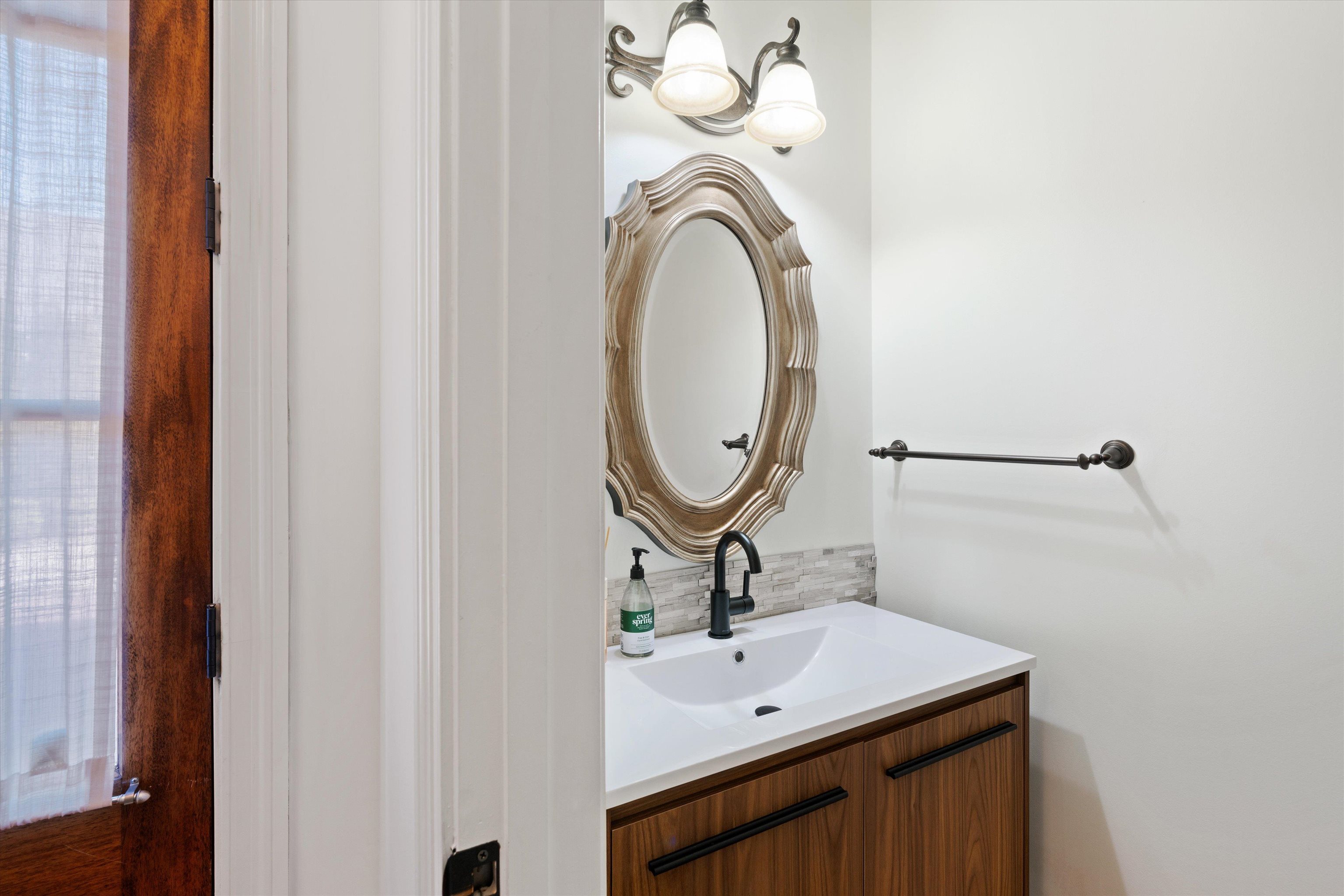 1247 Braywind Drive Collierville, TN 38017 - Photo 14 of 35 a bathroom with a sink and a mirror