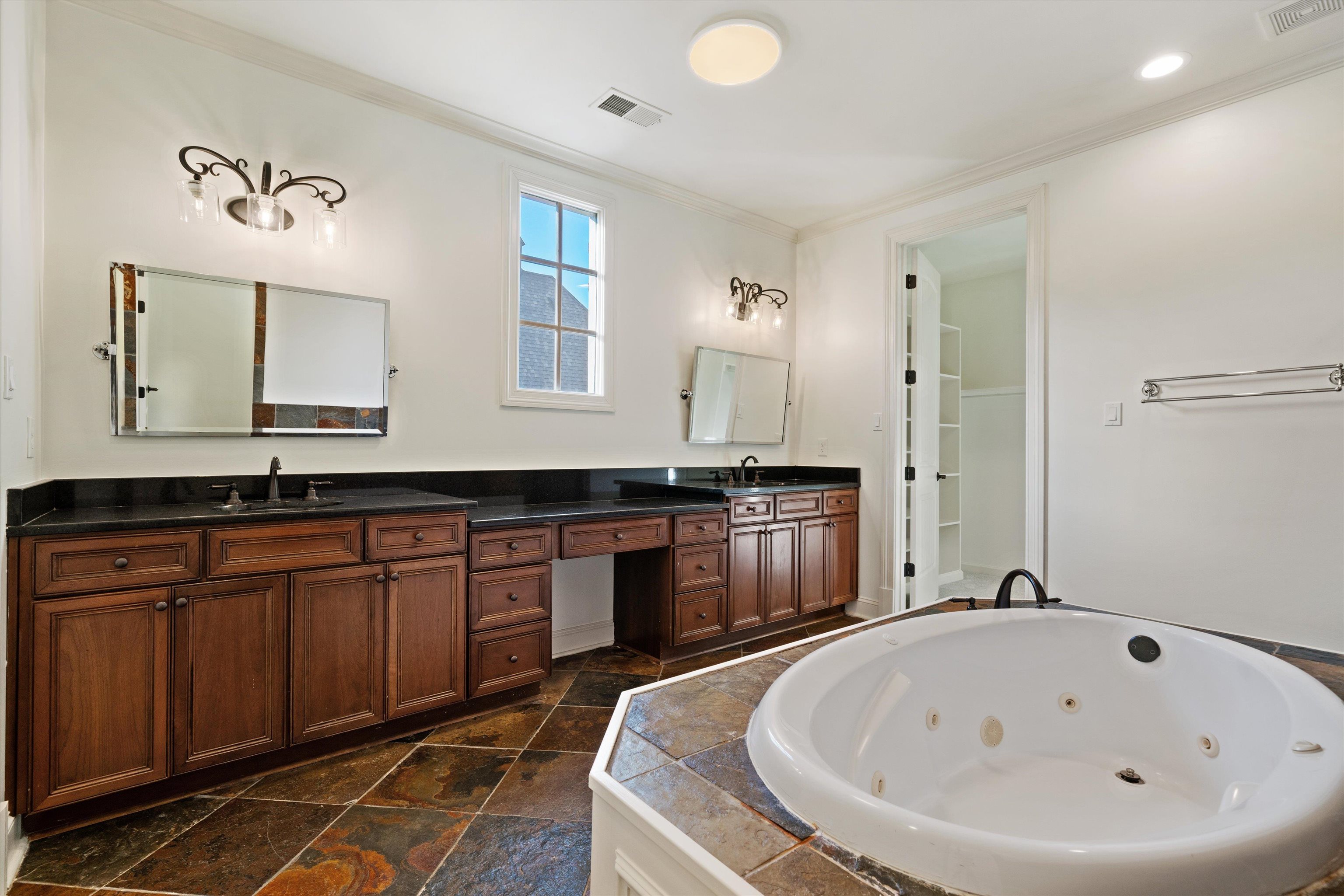1247 Braywind Drive Collierville, TN 38017 - Photo 18 of 35 a bath room with a sink and mirror