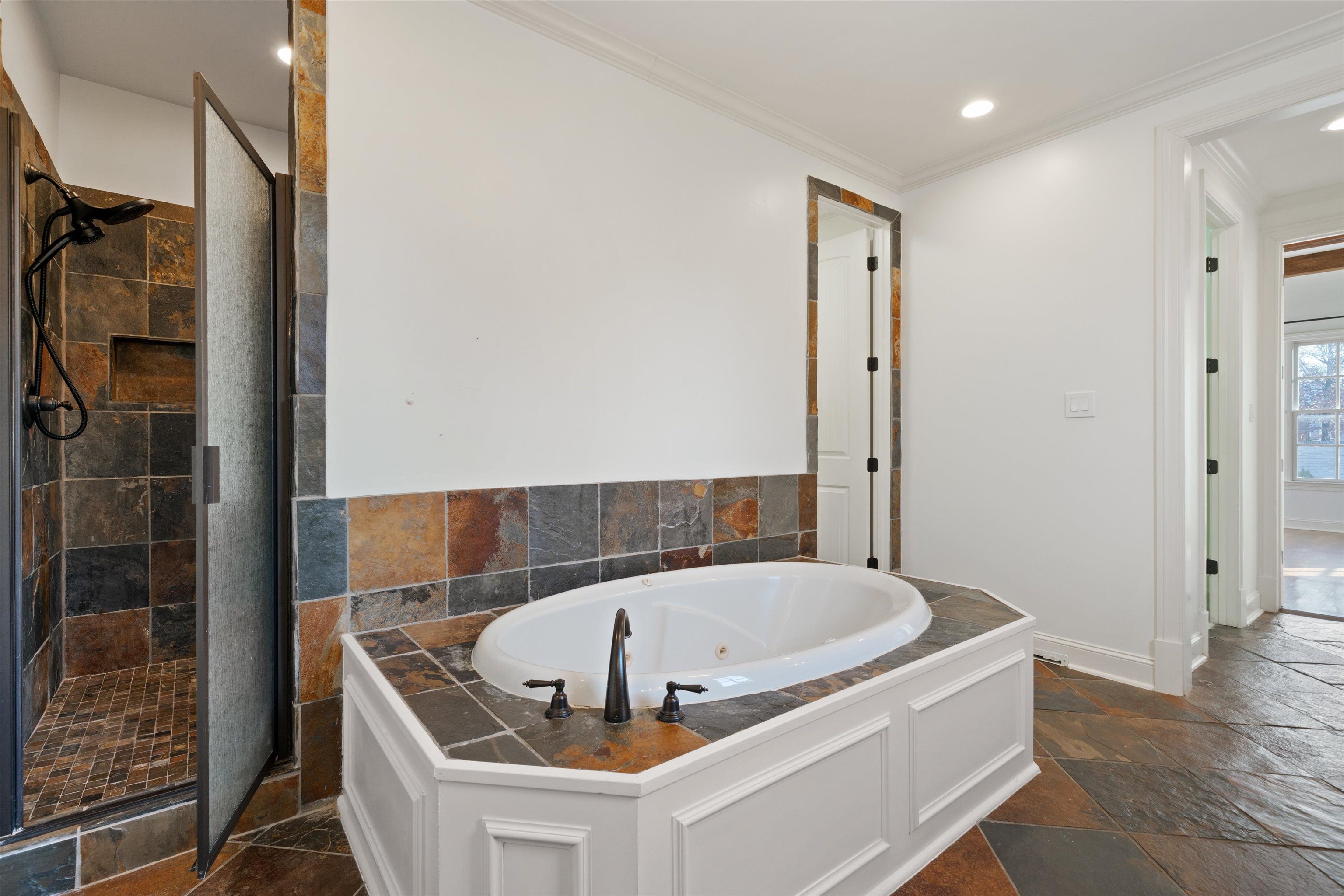 1247 Braywind Drive Collierville, TN 38017 - Photo 19 of 35 a bathroom with a tub and shower