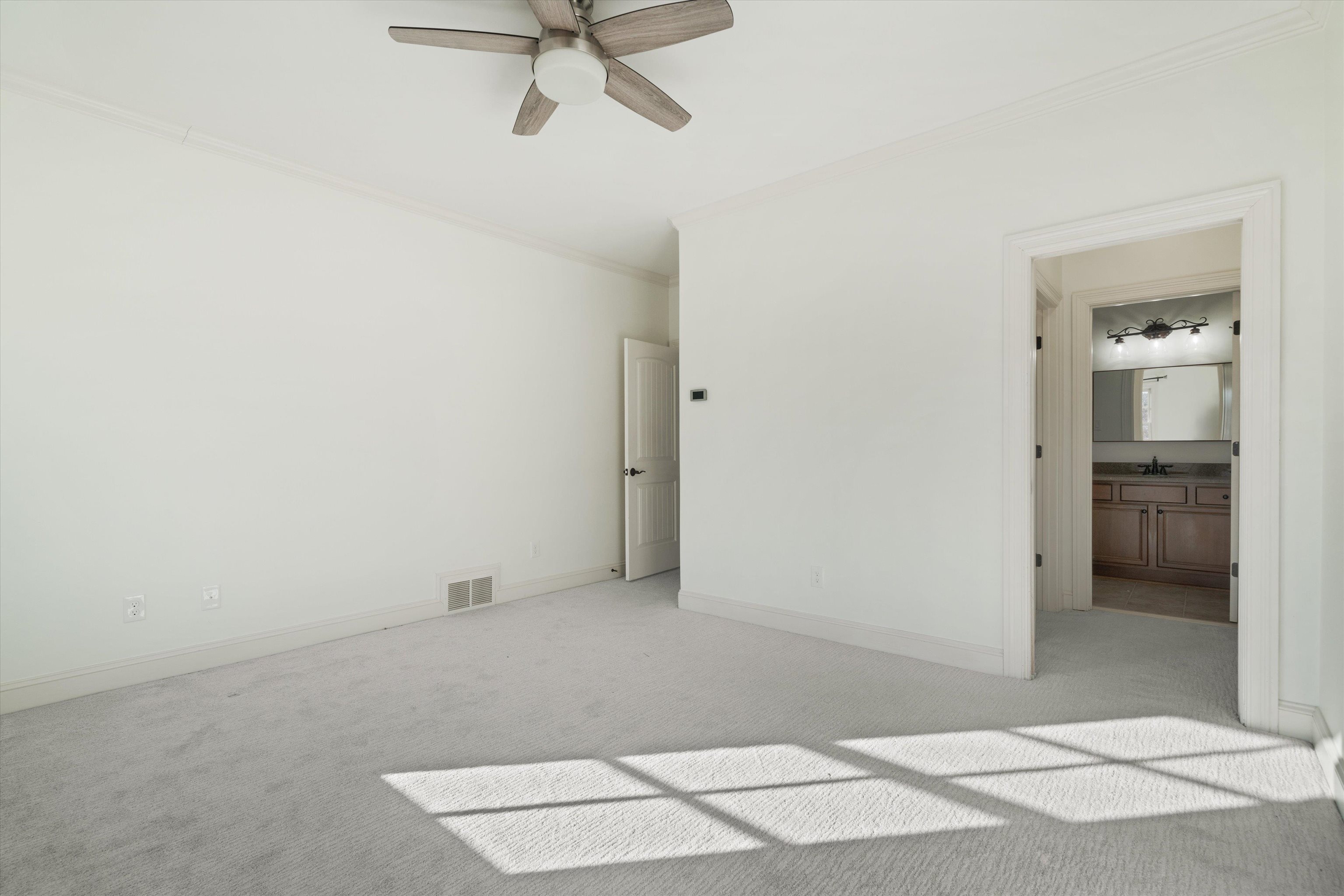 1247 Braywind Drive Collierville, TN 38017 - Photo 28 of 35 an empty room with fan and entrance