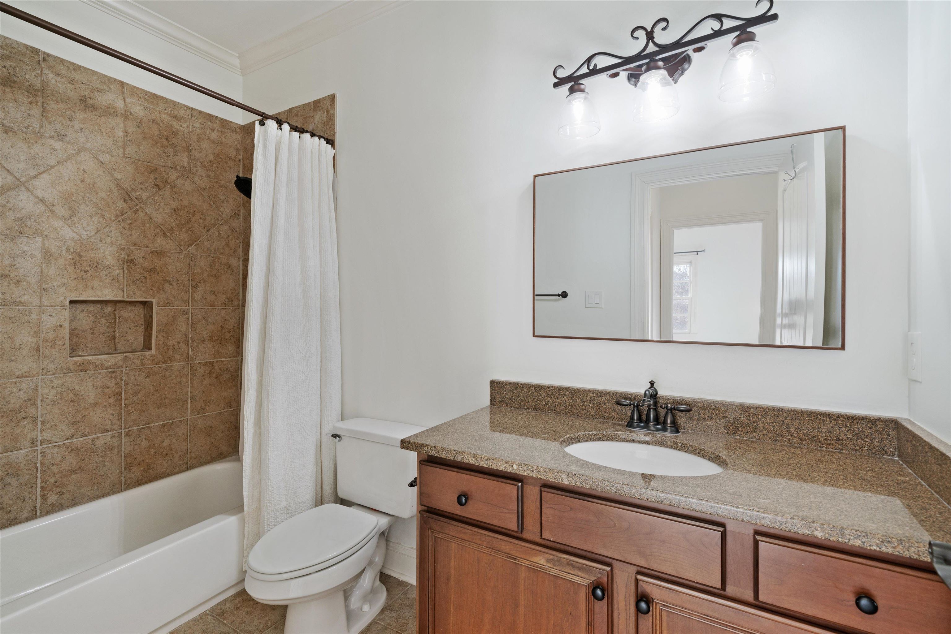 1247 Braywind Drive Collierville, TN 38017 - Photo 29 of 35 a bathroom with a granite countertop sink toilet and shower