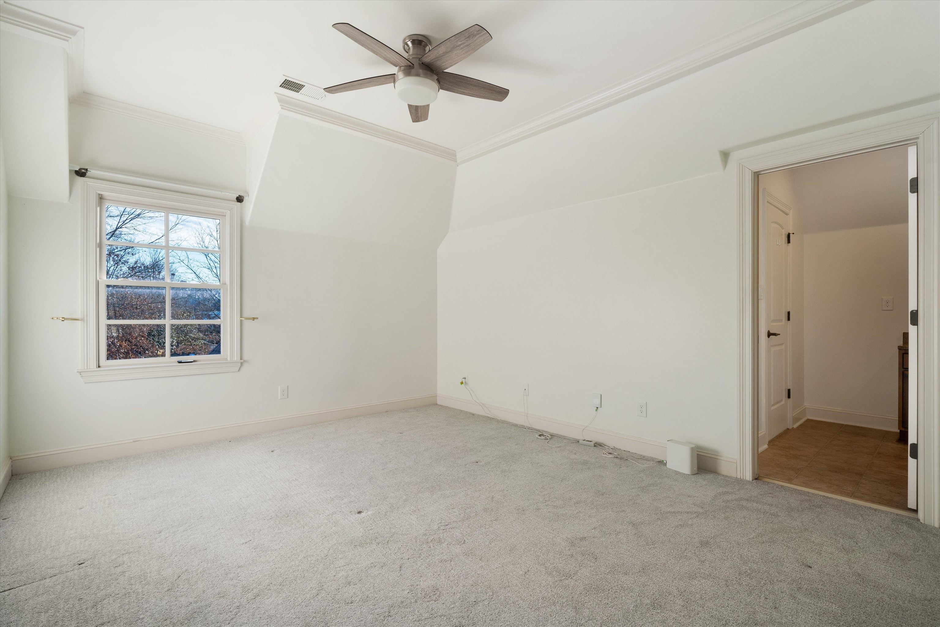 1247 Braywind Drive Collierville, TN 38017 - Photo 30 of 35 an empty room with windows and fan