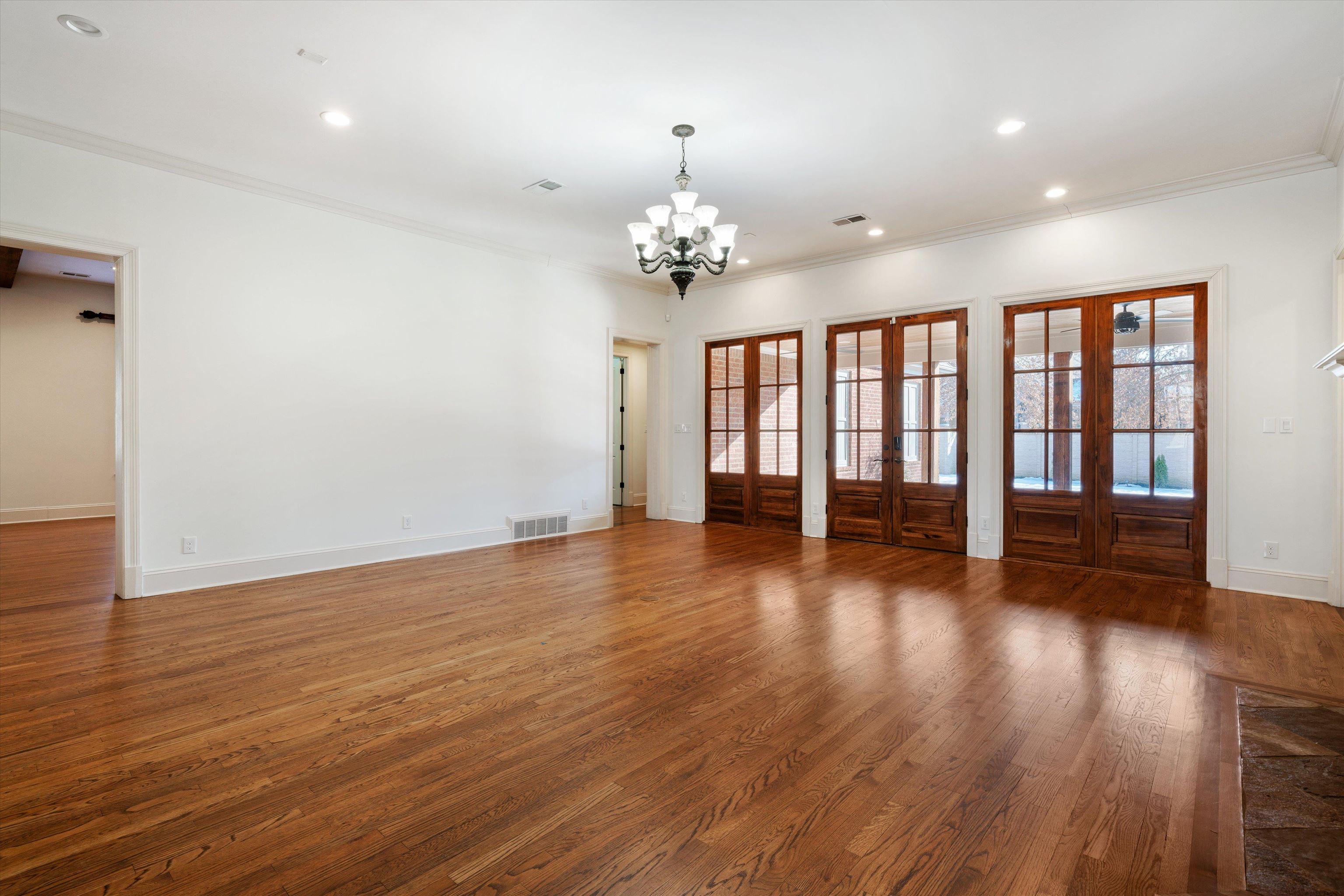1247 Braywind Drive Collierville, TN 38017 - Photo 3 of 35 a view of empty room with wooden floor and fan