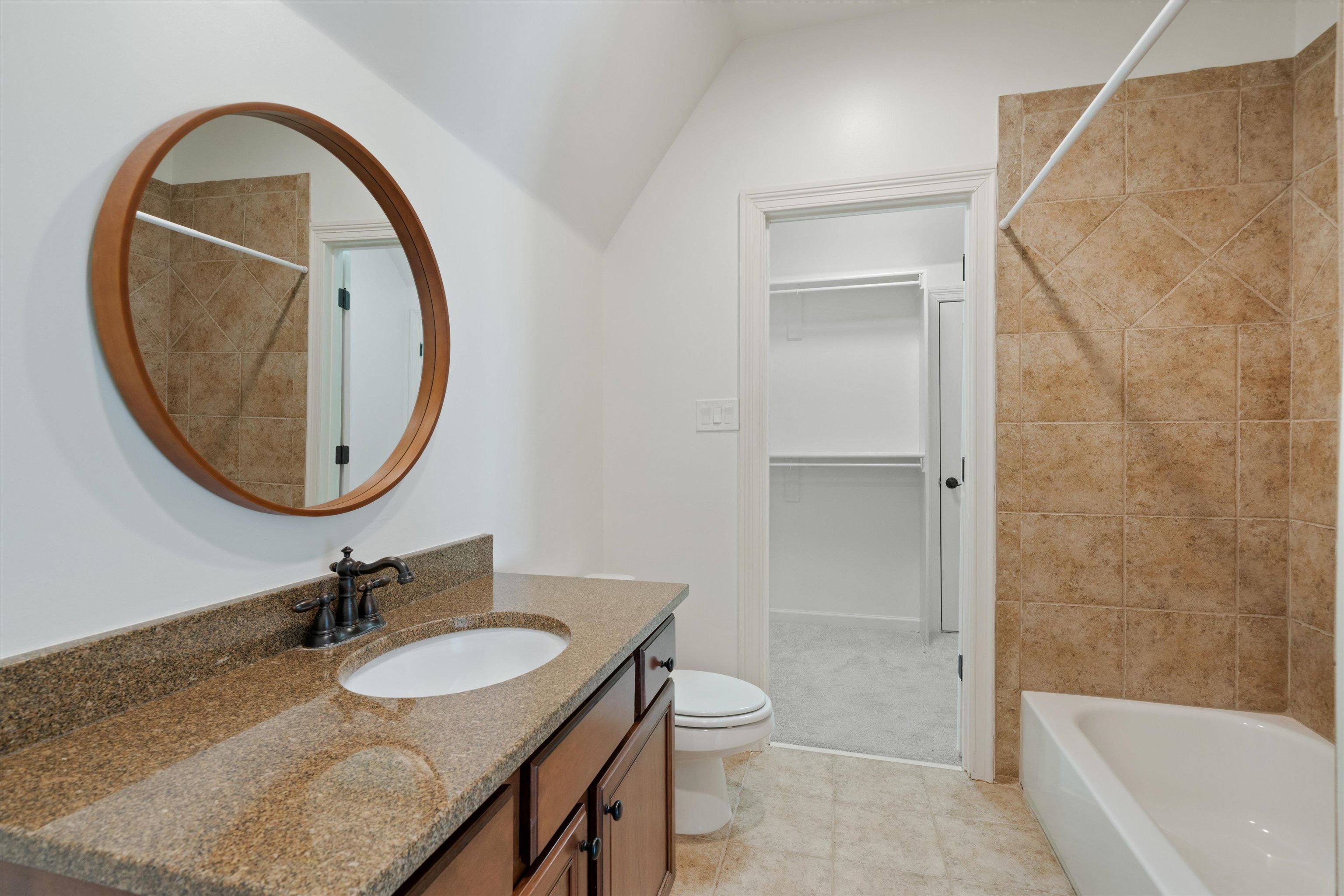 1247 Braywind Drive Collierville, TN 38017 - Photo 31 of 35 a bathroom with a sink and a mirror