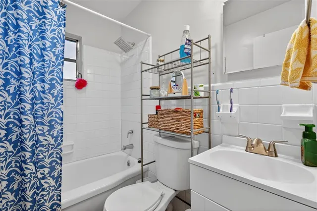 a bathroom with a bathtub and shower