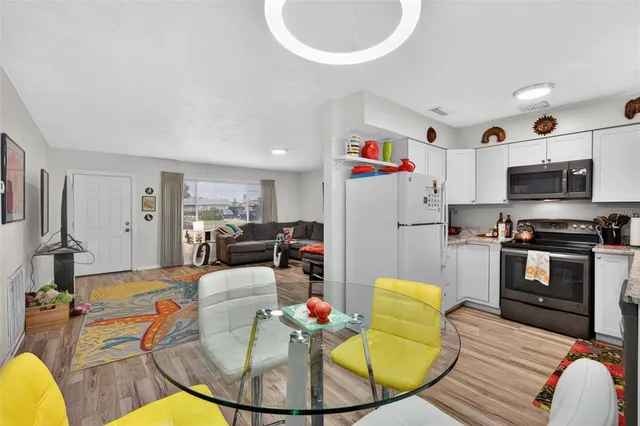 a white refrigerator freezer sitting inside of a kitchen